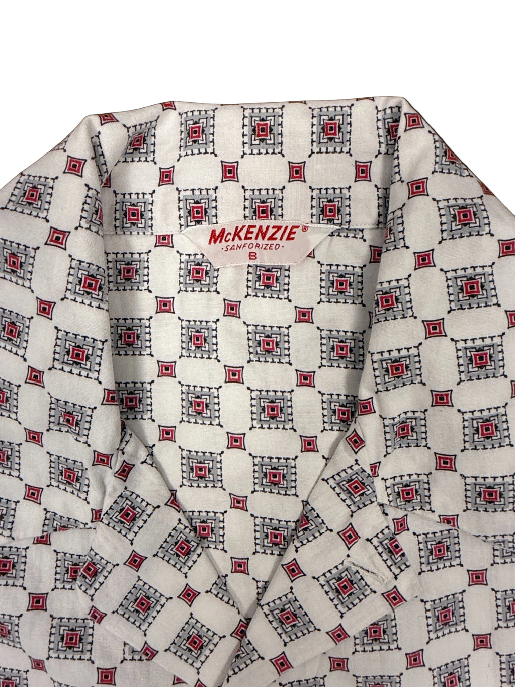 OMJ Vintage MCKENZIE pajama shirt with a white, red, grey, and black geometric tile print and notched collar.