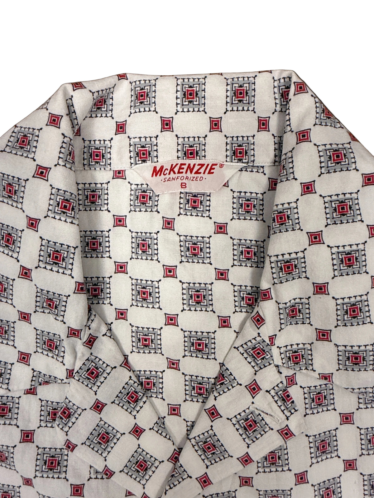 OMJ Vintage MCKENZIE pajama shirt with a white, red, grey, and black geometric tile print and notched collar.