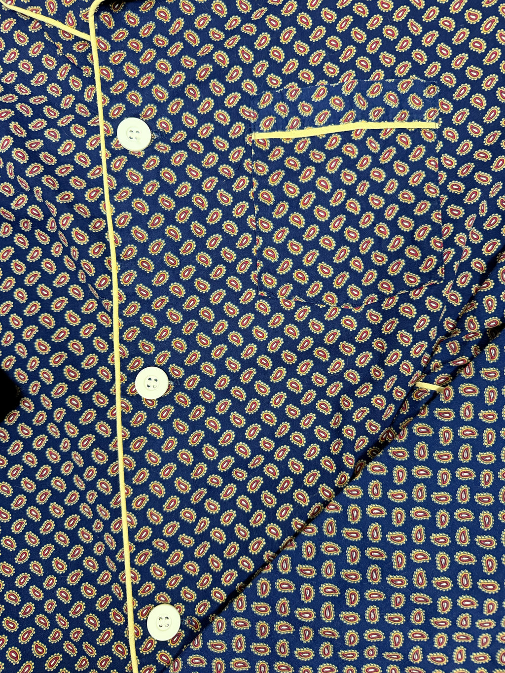 OMJ Vintage navy blue cotton pajama top with intricate paisley print, chest pocket, and yellow contrast piping.