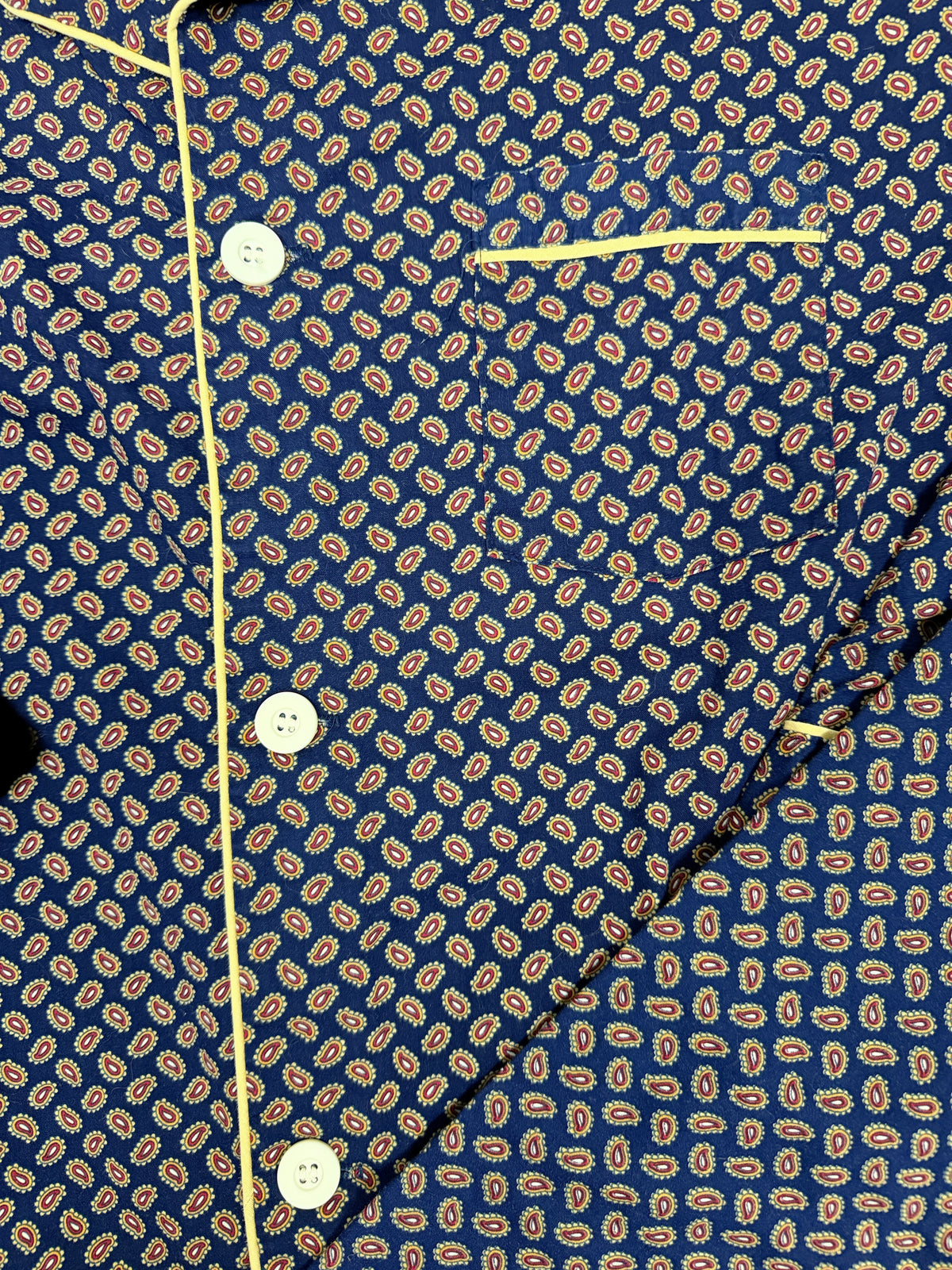 OMJ Vintage navy blue cotton pajama top with intricate paisley print, chest pocket, and yellow contrast piping.